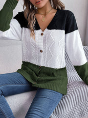 Colorblock cable knit cardigan with button front and v-neck in acrylic.