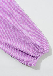 Lilac textured blouse with subtle stripe pattern and gathered balloon sleeve.