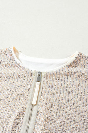 Sequin bomber jacket in cream with ribbed trim and silver zipper detail.