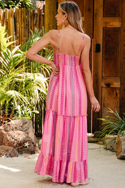 Pink chevron stripe tiered maxi dress with smocked bodice and spaghetti straps.