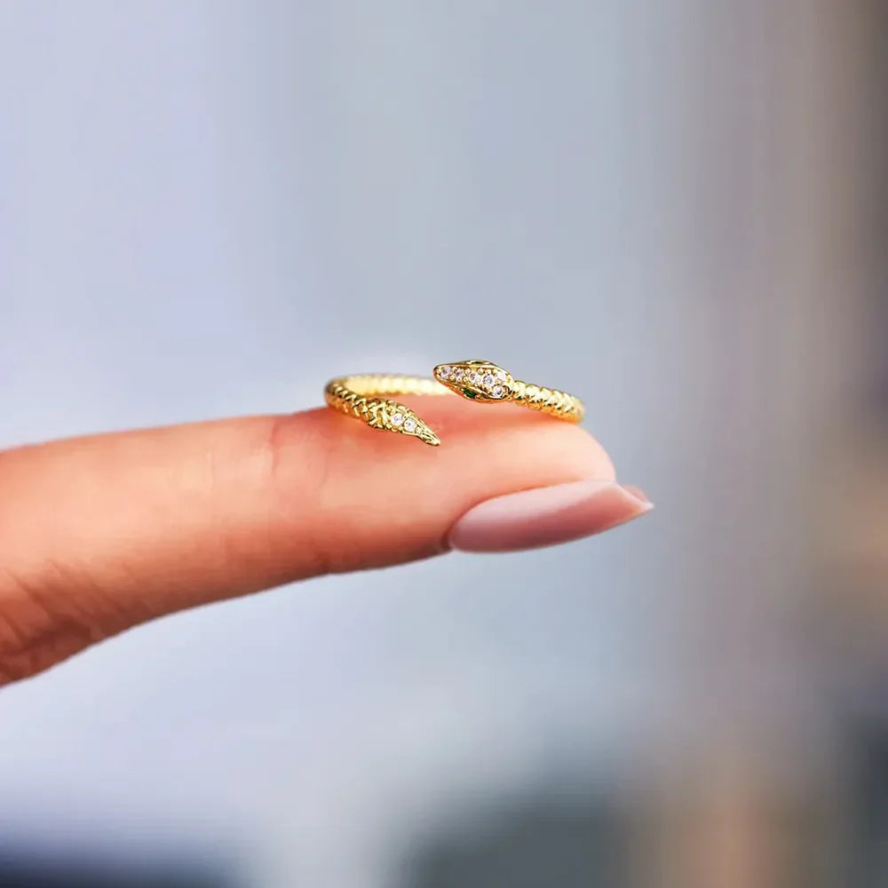 Gold bypass ring with diamond accent snake design