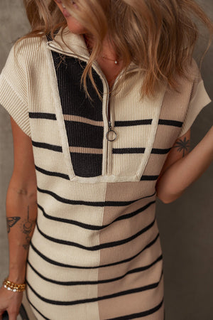 Colorblock ribbed mini dress with zip-neck and short sleeves in beige and black stripes.
