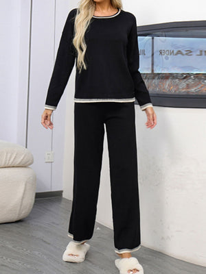 Black acrylic sweater set with contrast trim, crew neck, long sleeves, and wide-leg pants.