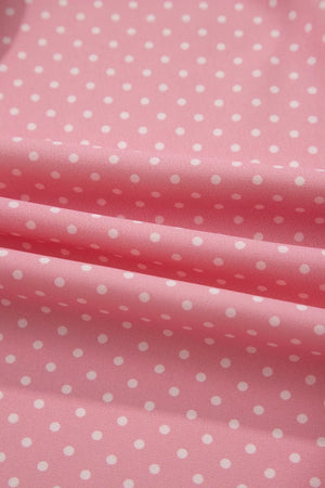 Pink polyester blouse with white polka dots
