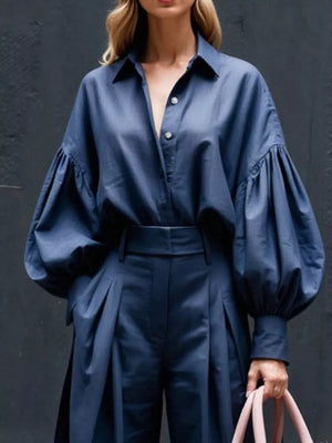 Blue lantern sleeve shirt and wide-leg pants set with button-up detail.