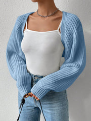 Light blue acrylic knit bolero shrug with wide sleeves and ribbed texture.