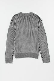 Black and white striped acrylic mock neck pullover sweater with ribbed details.