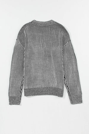 Black and white striped acrylic mock neck pullover sweater with ribbed details.