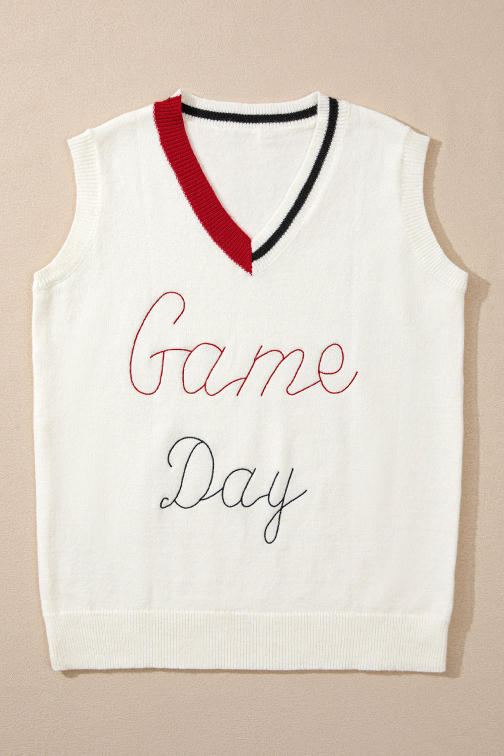 White knit vest with embroidered Game Day text, burgundy and black trim V-neck.