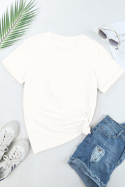 White crew neck t-shirt with a knotted hem detail, short sleeves, and a casual fit.