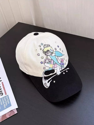 Black and beige cotton baseball cap with whimsical embroidered angel and stars.