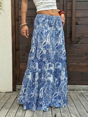 Bohemian paisley maxi skirt in blue with tiered ruffle hem and smocked waist.