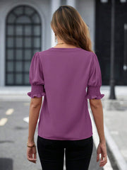 Mauve shirred sleeve blouse with puff sleeves and ruffled cuffs, showing the back view.