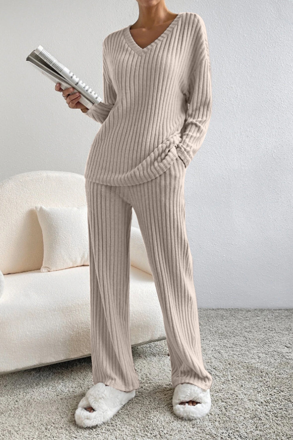 Ribbed knit lounge set in tan with V-neck sweater and wide-leg pants.