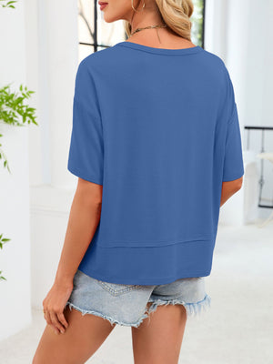 Relaxed fit blue t-shirt with short sleeves and a layered hem detail.