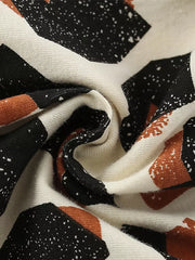 Zebra face graphic tee and shorts ensemble fabric detail with abstract black, white, and rust print.