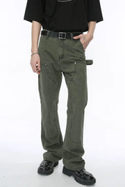 Army green wide leg carpenter pants with utility pockets and a relaxed fit.