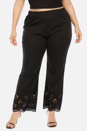 Black flare trousers with floral hem detail