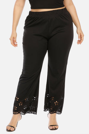 Black flare trousers with floral hem detail