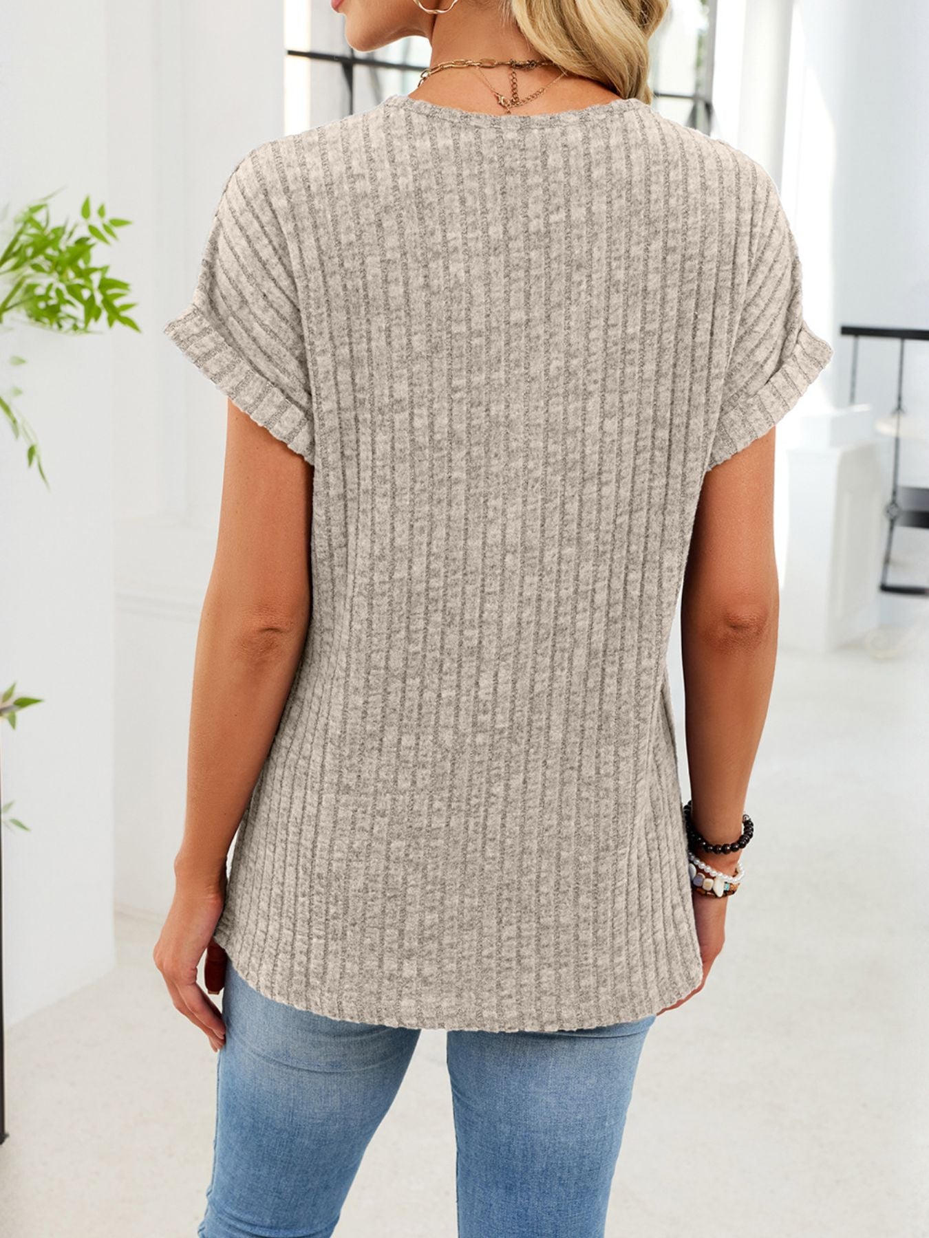 Ribbed knit v-neck t-shirt with buttons, short sleeves, light grey, casual women's top.