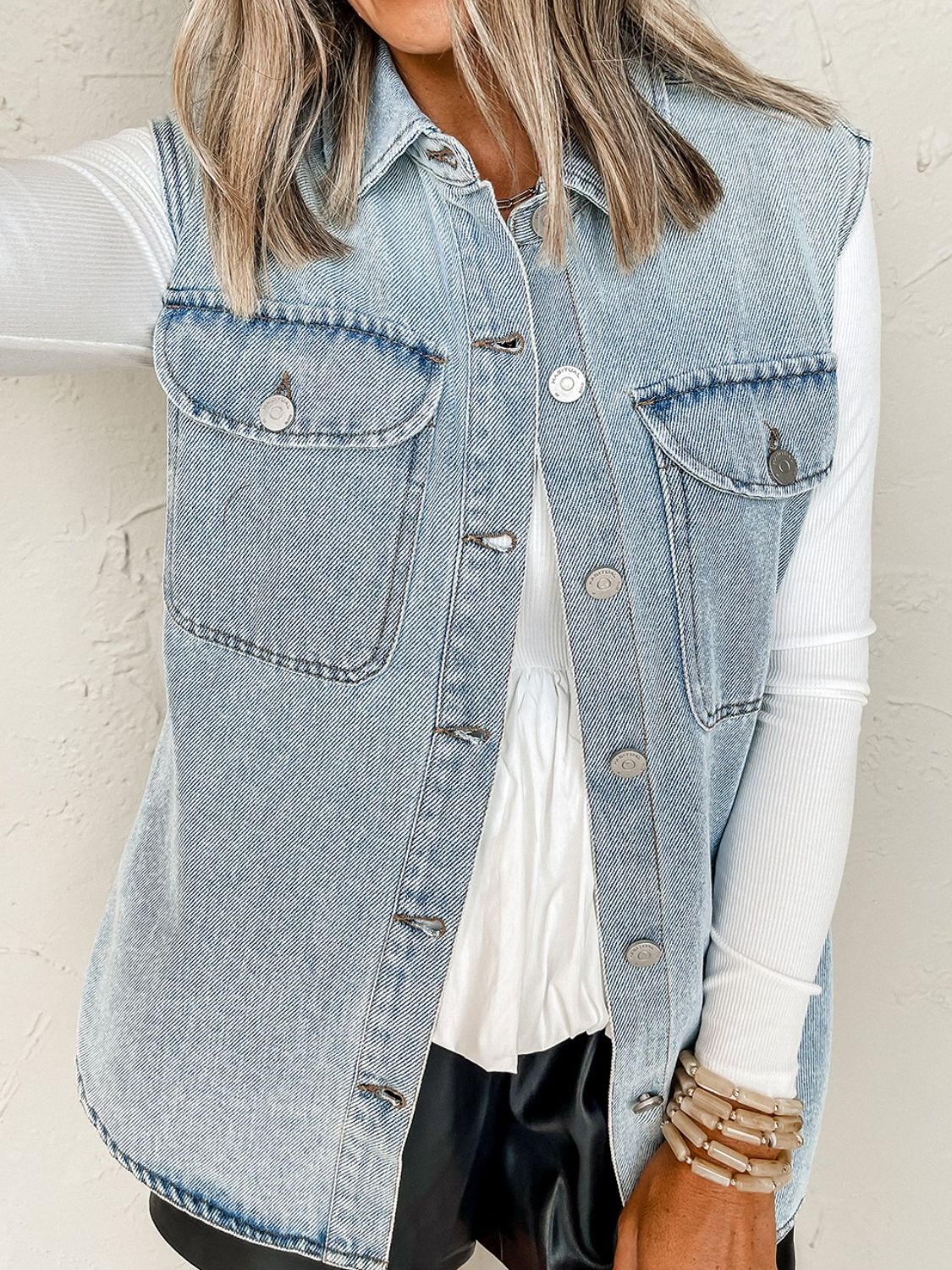 Medium wash oversized denim utility gilet with collared neckline and button front.