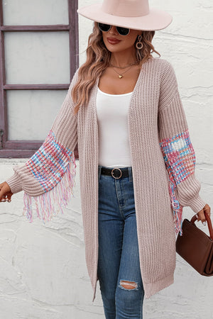 Textured sleeve fringe cardigan in acrylic with colorful sleeve detail and fringe.