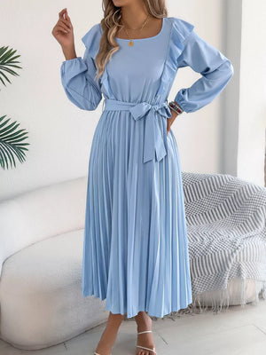 Blue midi dress with ruffles, long sleeves, belted waist, and pleated skirt.