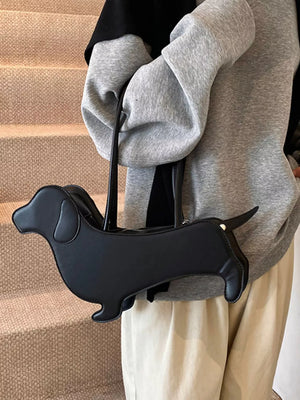 Black PU leather dachshund shoulder bag with zipper closure and top handles.