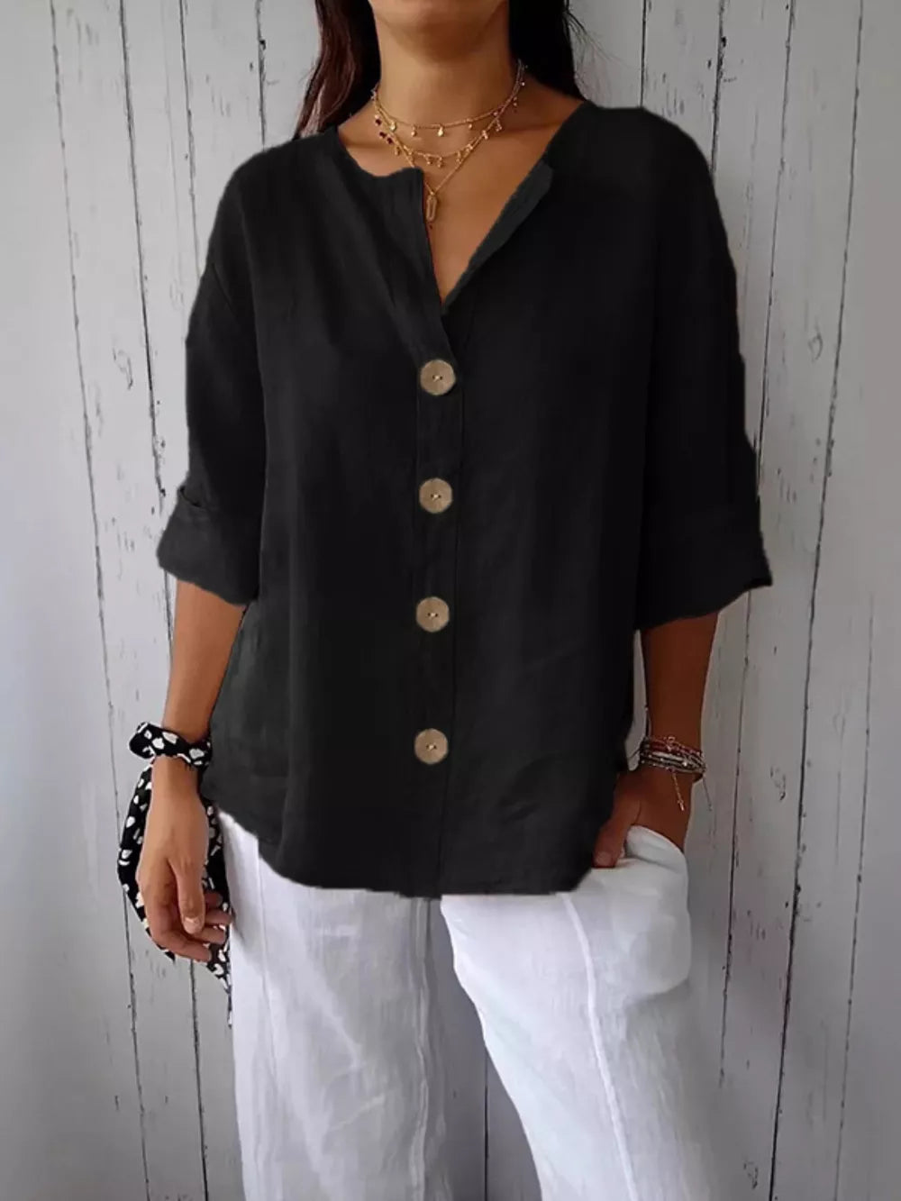 Black relaxed fit button-down shirt with three-quarter sleeves and wooden buttons.