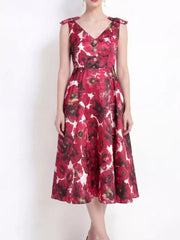 Floral midi dress with V-neck, bow shoulder details, and button accents.