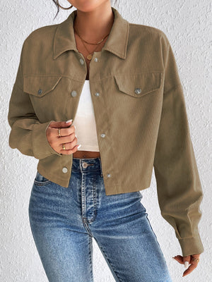 Cropped taupe corduroy snap-front jacket with chest pockets and a collared neckline.