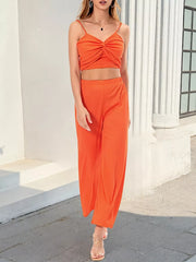 Orange twist-front crop top and wide-leg pants set with spaghetti straps