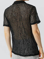Black openwork polo shirt with short sleeves and a collared neckline.