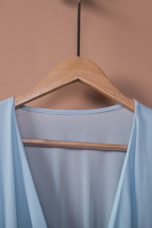 Sky blue mini dress with V-neck and ruffled detail.