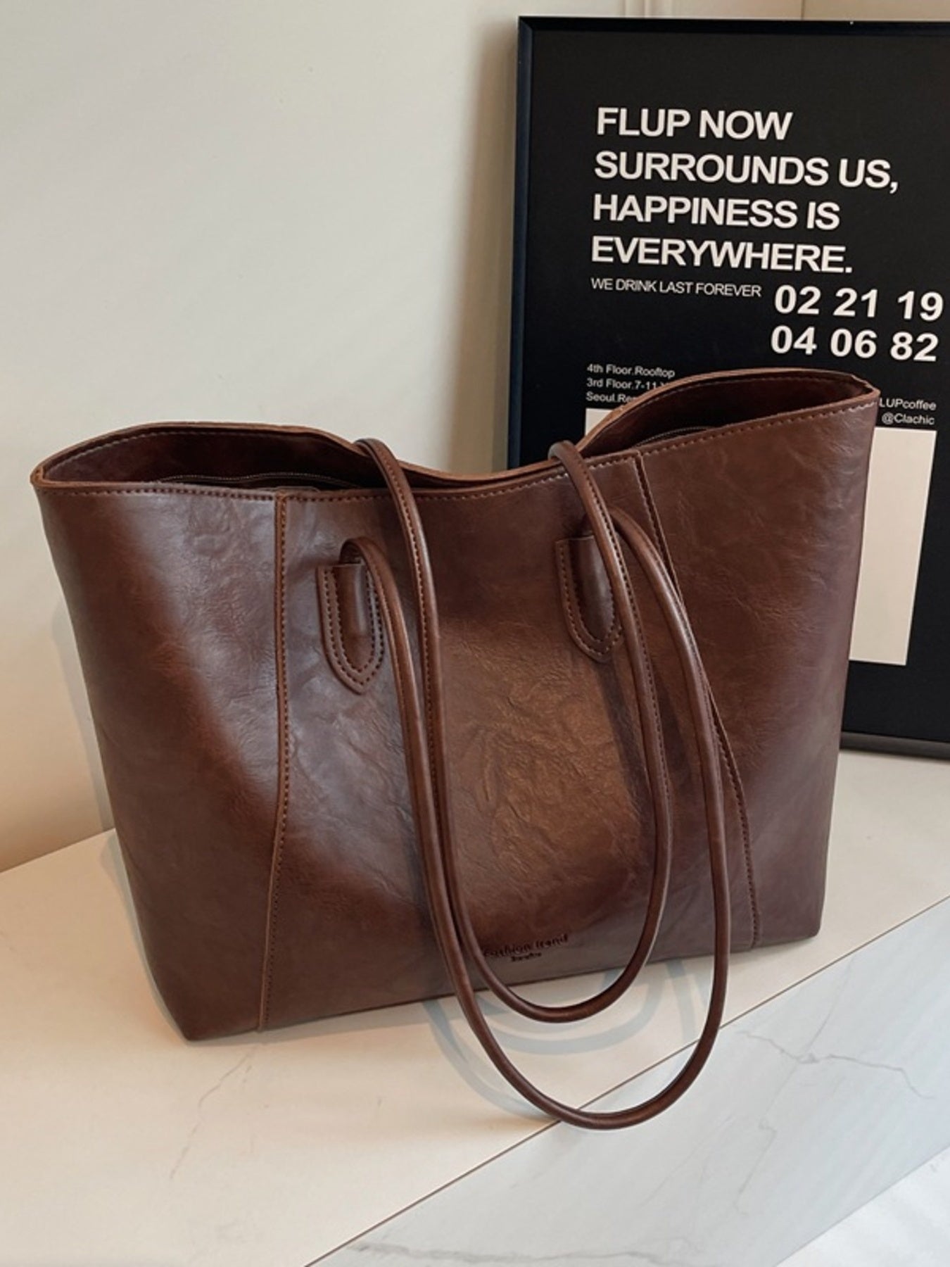 Premium crinkled pu leather tote bag in coffee brown with dual shoulder straps.