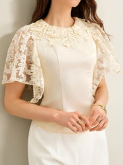 Apricot lace trimmed short-sleeve blouse with floral lace neckline and sleeves.