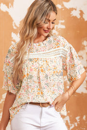 Floral ruffle trim blouse with lace detail and short sleeves.