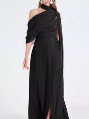 Black asymmetrical maxi dress with high slit and draped neckline.