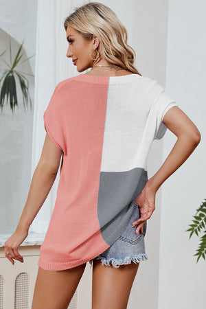 Split-tone knit tee with dolman sleeves in pink, white, and grey.