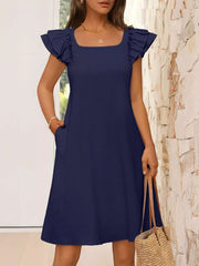 Navy blue a-line dress with ruffled cap sleeves and square neckline, featuring pockets.