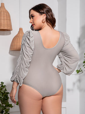 Light Gray one-piece swimsuit with ruched balloon sleeves and a scoop neckline.