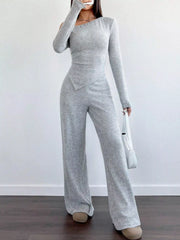 Light gray one-shoulder ribbed knit set with wide-leg pants and asymmetrical hem top.