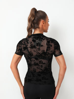 Black velvet floral mesh mock neck top with short sleeves.