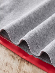 Light Gray cotton pajama set detail showing red trim and stitching.
