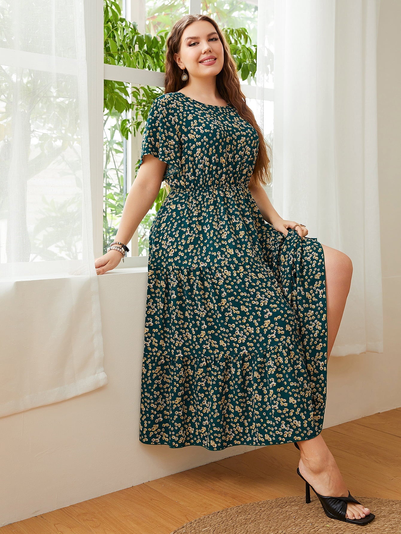 Emerald floral tiered midi dress with short sleeves and smocked waist.