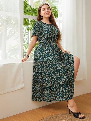 Emerald floral tiered midi dress with short sleeves and smocked waist.