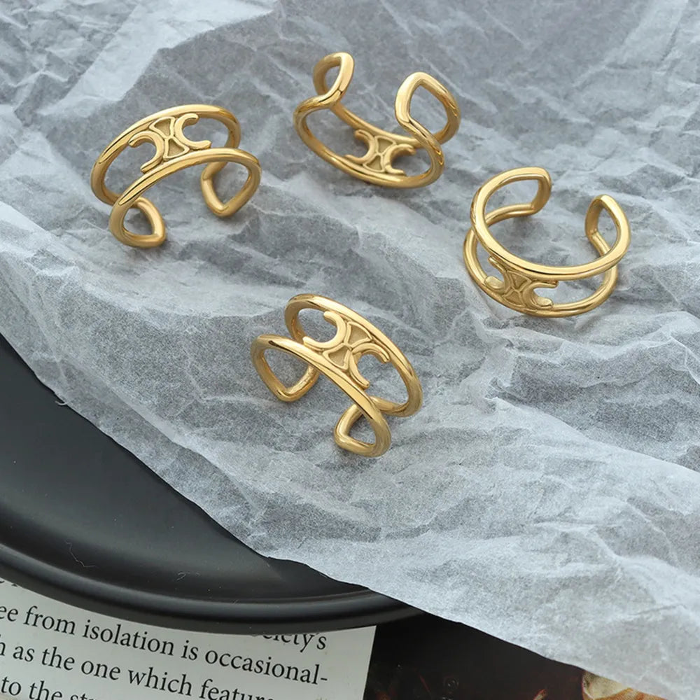 Gold double banded open ring with cutout detail.