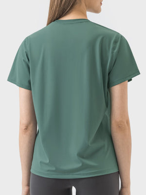 Dark green performance tee with short sleeves and a crew neck, shown from the back.