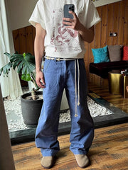 Men's blue relaxed fit sweatpants with drawstring and pockets.