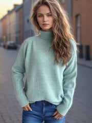 Relaxed raglan turtleneck knit sweater in Pastel Blue with ribbed cuffs and hem.